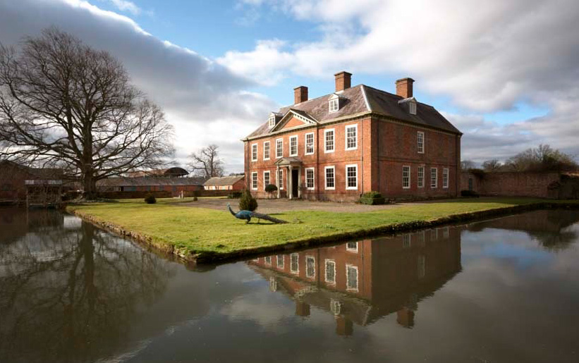 The house in Herefordshire dates back to 1700. Not so the peacock. The house has a canal-like waterw