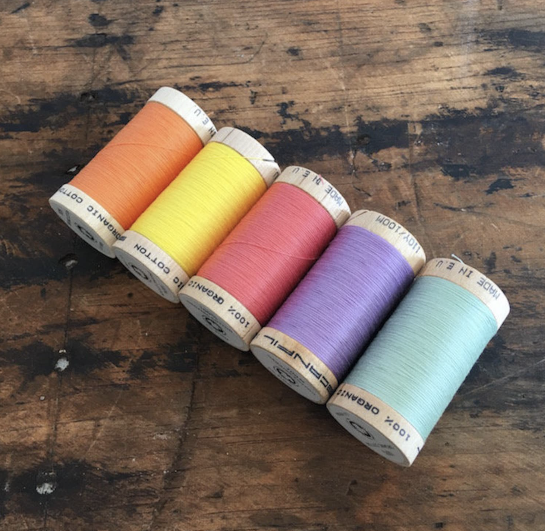 Organic cotton thread on wooden spool, 34 colours, £3.50 per 100m spool. James Tailoring on Etsy